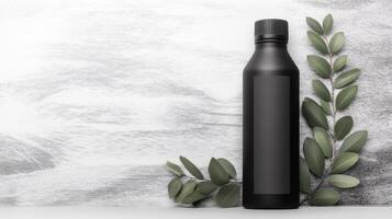 Sleek black bottle with minimalist label, botanical accents nearby photo