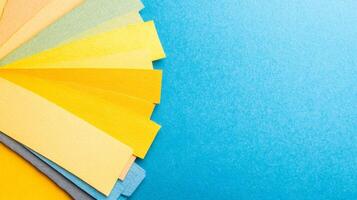 Colorful Paper Swatches on a Blue Background photo