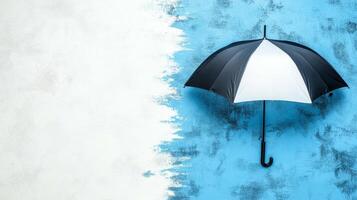 Black and White Umbrella on a Blue Wall photo