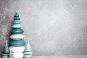 Stacked Candle Christmas Trees on Gray Surface photo