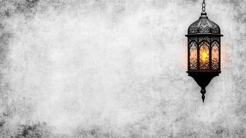 Hanging Lantern on a Textured Gray Wall photo