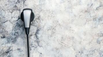 Modern Wall Charger for Electric Vehicles on Marble Surface photo