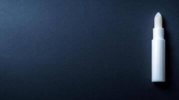 White Lip Balm Stick on a Dark Background photo