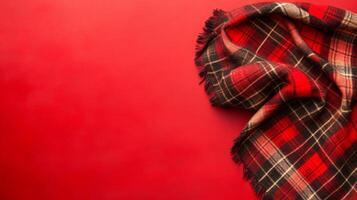 Plaid Textile on a Solid Red Background photo