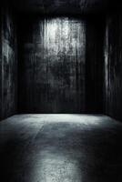 Dark Concrete Room with Light on Wall photo