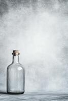 Clear Glass Bottle with Cork Stopper on Gray Surface photo