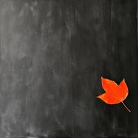 Red Leaf on a Black Textured Background photo