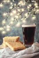 Dark Beer with Toast on a Festive Table photo