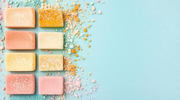 Colored Square Candies on a Blue Background photo