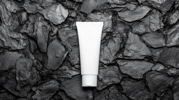 White Tube on a Rough Stone Background photo