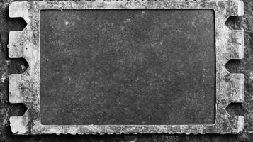 Metal Frame on a Dark Stone Background photo