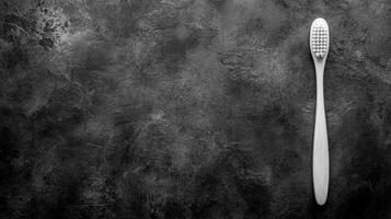 Wooden Toothbrush on a Textured Gray Background photo