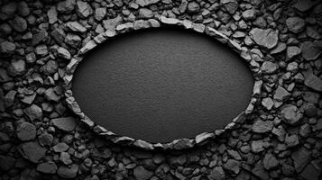 Circular Void Framed by Rough Black Stones on a Dark Surface photo