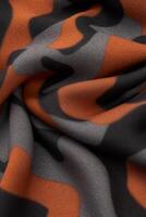 Textured Fabric with Abstract Camouflage Pattern in Warm Tones photo