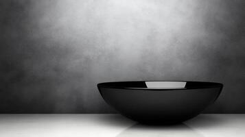 Black Bowl on White Surface with Gray Background photo
