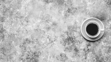 Dark Beverage in White Cup on Mottled Gray Background photo
