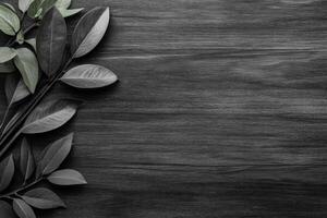 Monochrome Leaves on a Dark Wooden Plank Surface photo