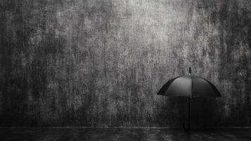 Monochrome Umbrella Against a Dark Textured Wall photo