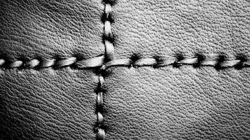 Close Up of Stitched Leather with Crossed Seams in Monochrome photo