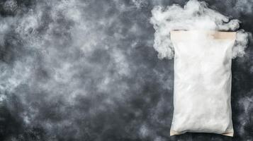 White Pouch with Smoke Cloud on Dark Textured Surface photo