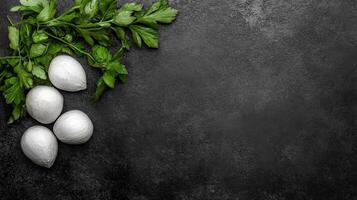 Fresh Whole Garlic Bulbs Nestled Among Vibrant Parsley on Dark Slate photo