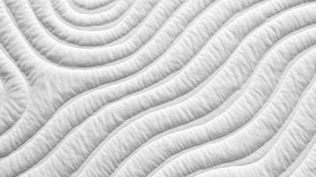 White Quilted Fabric with Wavy Pattern photo