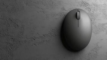 Sleek Gray Wireless Mouse on a Matter Dark Gray Background photo