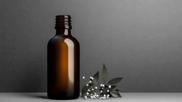 Amber Glass Bottle with Black Cap Beside White Berries on a Gray Surface photo