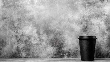 Solitary Black Coffee Cup on a Weathered Gray Stone Surface photo