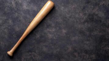 Wooden Baseball Bat on a Dark Textured Surface photo