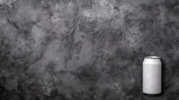 Chilled Silver Can with Dew Drops on a Rough Gray Wall photo
