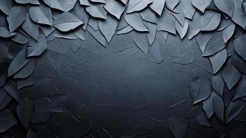 Dense Gray Leaves Carved into a Dark Textures Stone Wall photo