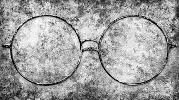 a pair of glasses on a grungy wall photo