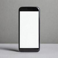 Modern Mobile Phone Standing Upright with Blank White Screen photo