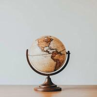 Vintage Style Desktop Globe Showing Earth's Continents on Wooden Stand photo