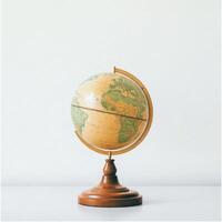 Vintage Style Desk Globe Showing Earth's Continents on a Wooden Stand photo