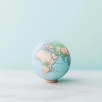 Small Desktop Globe Showing Continents on a Marble Surface photo