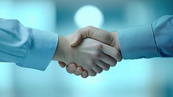 Close Up of Firm Handshake in Blurred Meeting Room Setting photo