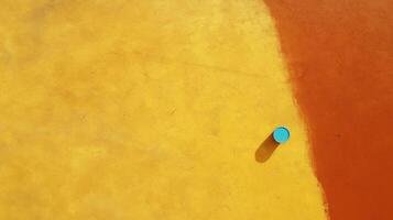 Colorful Abstract Background with Blue Circle on Bright Yellow and Orange Wall Surface for Design Use photo