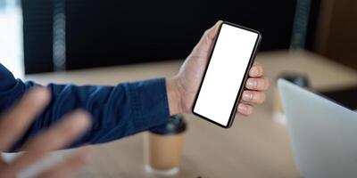 Technology and Connectivity. A man shows a smartphone during a business discussion. photo