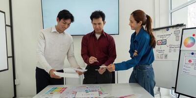 Design Workshop and Interactive Learning. Team members exchanging wireframe ideas in a productive environment. photo