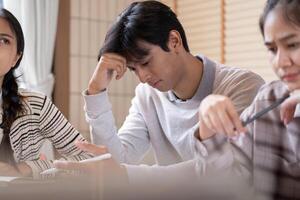 Concentration and Problem Solving. A student reflecting while working through challenging study material. photo