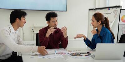 Interactive UX UI Brainstorming. Designers animatedly discuss creative ideas and approaches for effective user interface design. photo