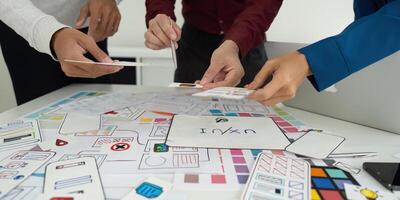 Team Meeting and Design Planning. Designers brainstorming ideas for a user-friendly interface. photo