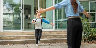 Celebrating Arrival and Connection. A child joyfully runs to greet a parent after school, showcasing love and support. photo