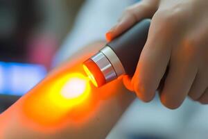 A person is using an infrared light to check their skin photo
