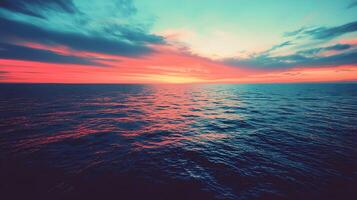 Serene Ocean Sunset Vibrant Pink and Teal Sky over Calm Waters photo