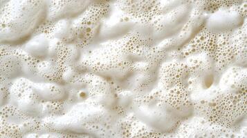 Close up Texture of Creamy White Foam with Air Bubbles Abstract Background photo