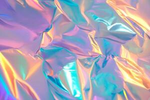 Colorful reflective foil with an iridescent sheen creating a vibrant backdrop suitable for various creative projects photo