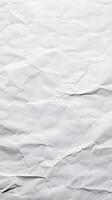 Crumpled white paper background displaying intricate textures and patterns in natural light, ideal for creative projects and design purposes photo